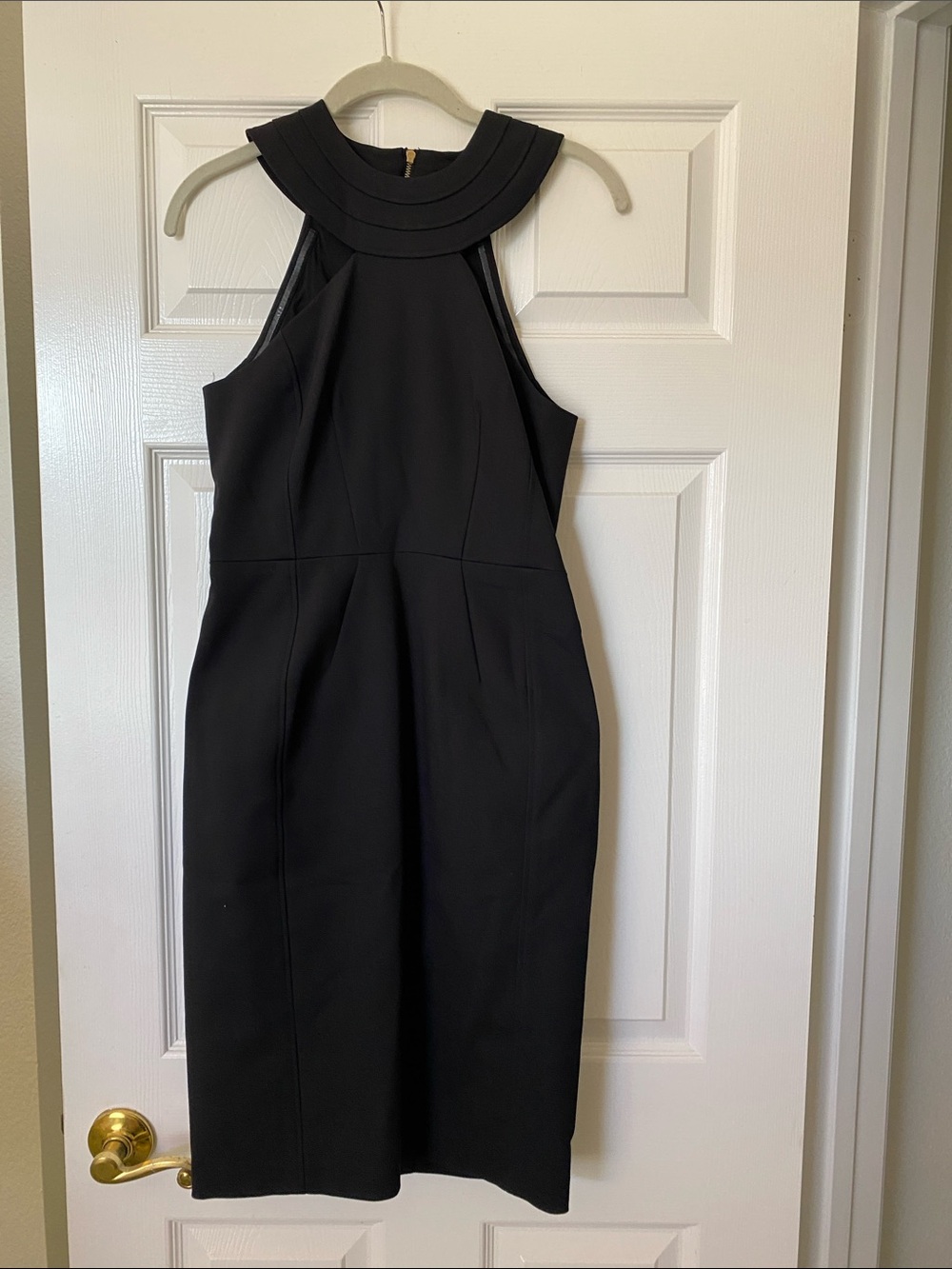 In excellent condition size 4 Classic Black Halter Sheath Dress